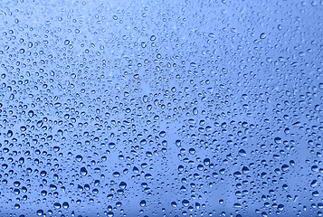 Image showing Water drops on glass, natural blue texture