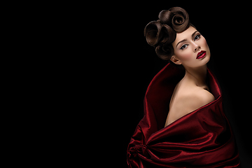 Image showing beautiful young woman with fancy hairdo and red lips