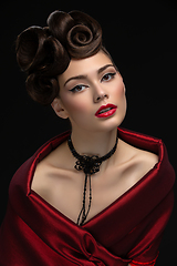 Image showing beautiful young woman with fancy hairdo and red lips