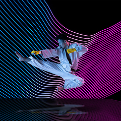 Image showing Creative sport and neon waves on dark neon lighted line background