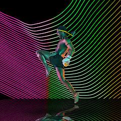 Image showing Creative sport and neon waves on dark neon lighted line background