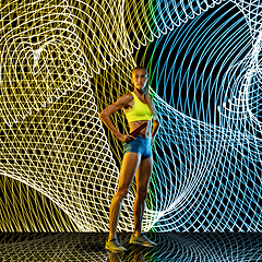 Image showing Creative sport and neon waves on dark neon lighted line background