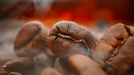 Image showing Close up of seeds of coffee. Fragrant coffee beans are roasted s