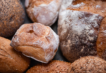 Image showing Freshly baked natural bread is on the kitchen table.