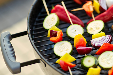 Image showing close up of vegetables roasting on brazier grill