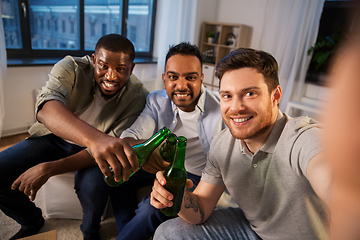 Image showing happy male friends with beer taking selfie at home