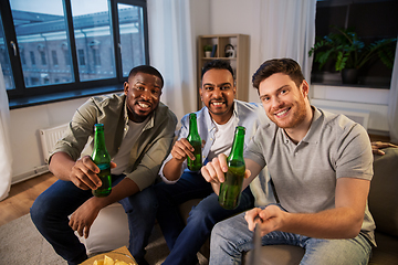 Image showing happy male friends with beer taking selfie at home