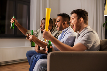 Image showing friends or soccer fans with ball and beer at home