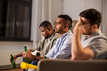 Image showing sad friends with ball and vuvuzela watching soccer