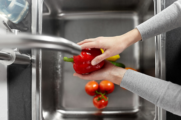 Image showing woman washing fruits and vegetables in kitchen