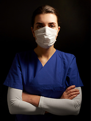 Image showing female doctor or nurse in medical face mask