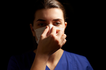 Image showing female doctor or nurse in medical face mask