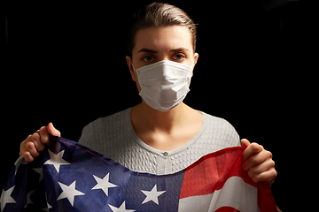 Image showing sick woman in face mask holding flag of america