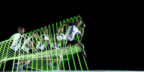 Image showing Creative sport and neon waves on dark neon lighted line background