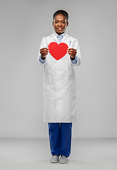 Image showing african american female doctor with red heart