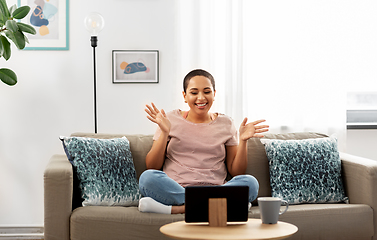 Image showing african woman having video call on tablet pc