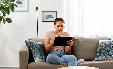 Image showing african american woman with tablet pc at home