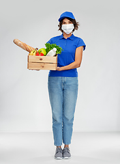 Image showing delivery woman in face mask with food in box