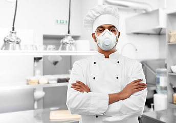 Image showing male chef in respirator at restaurant kitchen