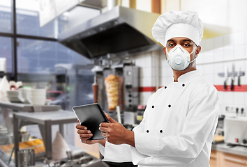 Image showing chef in respirator with tablet pc at kebab shop