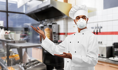 Image showing male chef in respirator at kebab shop kitchen