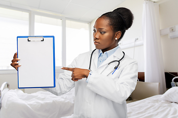 Image showing african american doctor with clipboard at hospital