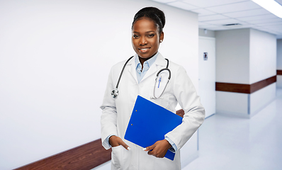 Image showing african female doctor with clipboard at hospital