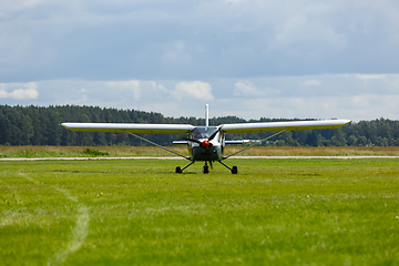 Image showing small plane on green field before take-off outdoors