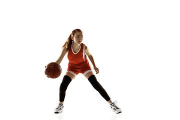 Image showing Young caucasian female basketball player against white studio background