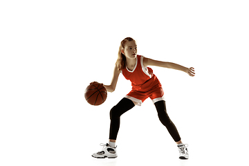 Image showing Young caucasian female basketball player against white studio background