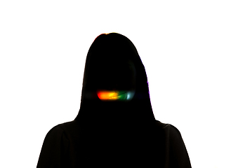 Image showing Dramatic portrait of a girl in the dark on white studio background with rainbow colored line