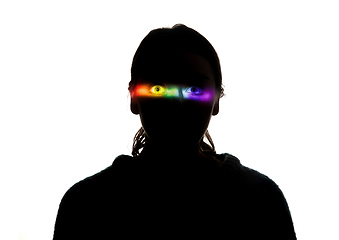 Image showing Dramatic portrait of a girl in the dark on white studio background with rainbow colored line