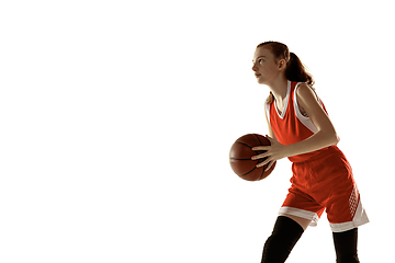 Image showing Young caucasian female basketball player against white studio background