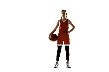 Image showing Young caucasian female basketball player against white studio background