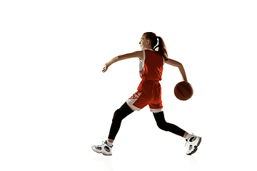 Image showing Young caucasian female basketball player against white studio background