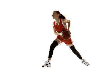 Image showing Young caucasian female basketball player against white studio background