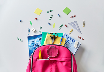Image showing pink backpack with books and school supplies