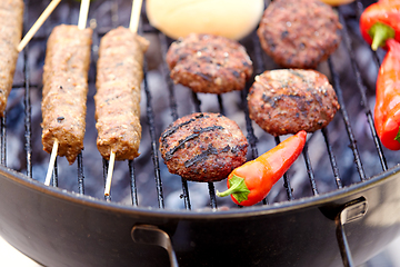 Image showing barbecue kebab meat and vegetables on grill