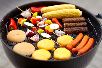 Image showing barbecue kebab meat and vegetables on grill