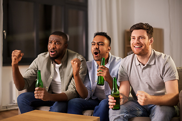 Image showing happy male friends or fans drinking beer at home