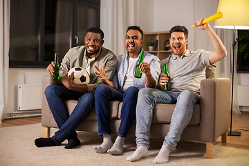 Image showing friends or soccer fans with ball and beer at home