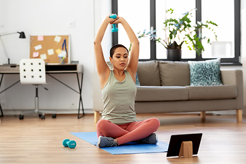 Image showing woman with tablet pc and dumbbell training at home