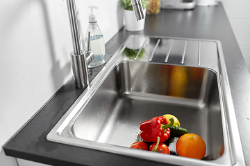 Image showing fruits and vegetables in kitchen sink