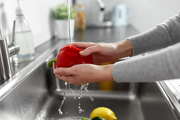 Image showing woman washing fruits and vegetables in kitchen