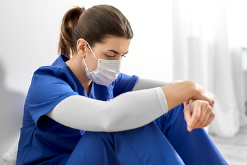 Image showing sad doctor or nurse in protective face mask