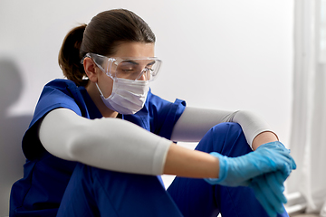 Image showing sad doctor or nurse in goggles and face mask