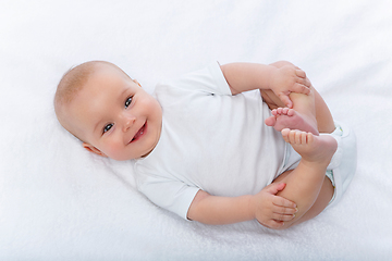 Image showing happy beautiful baby girl in white body suit