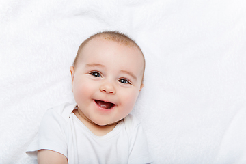 Image showing happy beautiful baby boy in white body suit