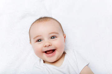 Image showing happy beautiful baby boy in white body suit