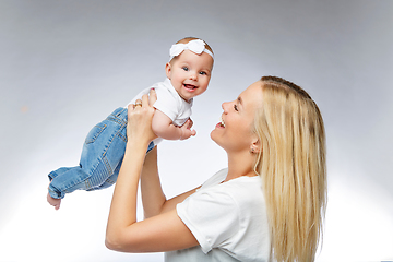 Image showing beautiful young mother with toddler baby girl